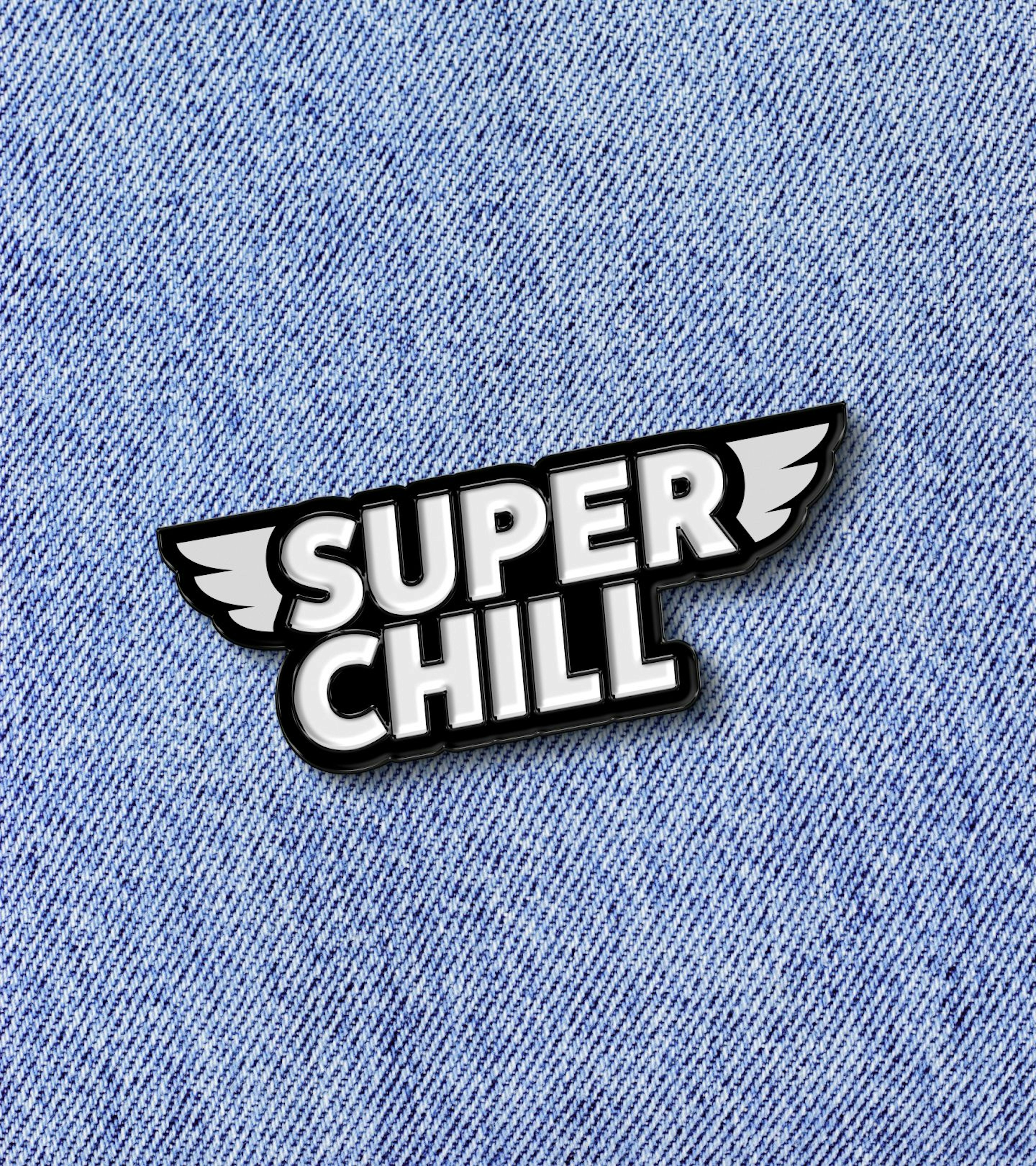 A badge with wings printed on a light and blue jeans