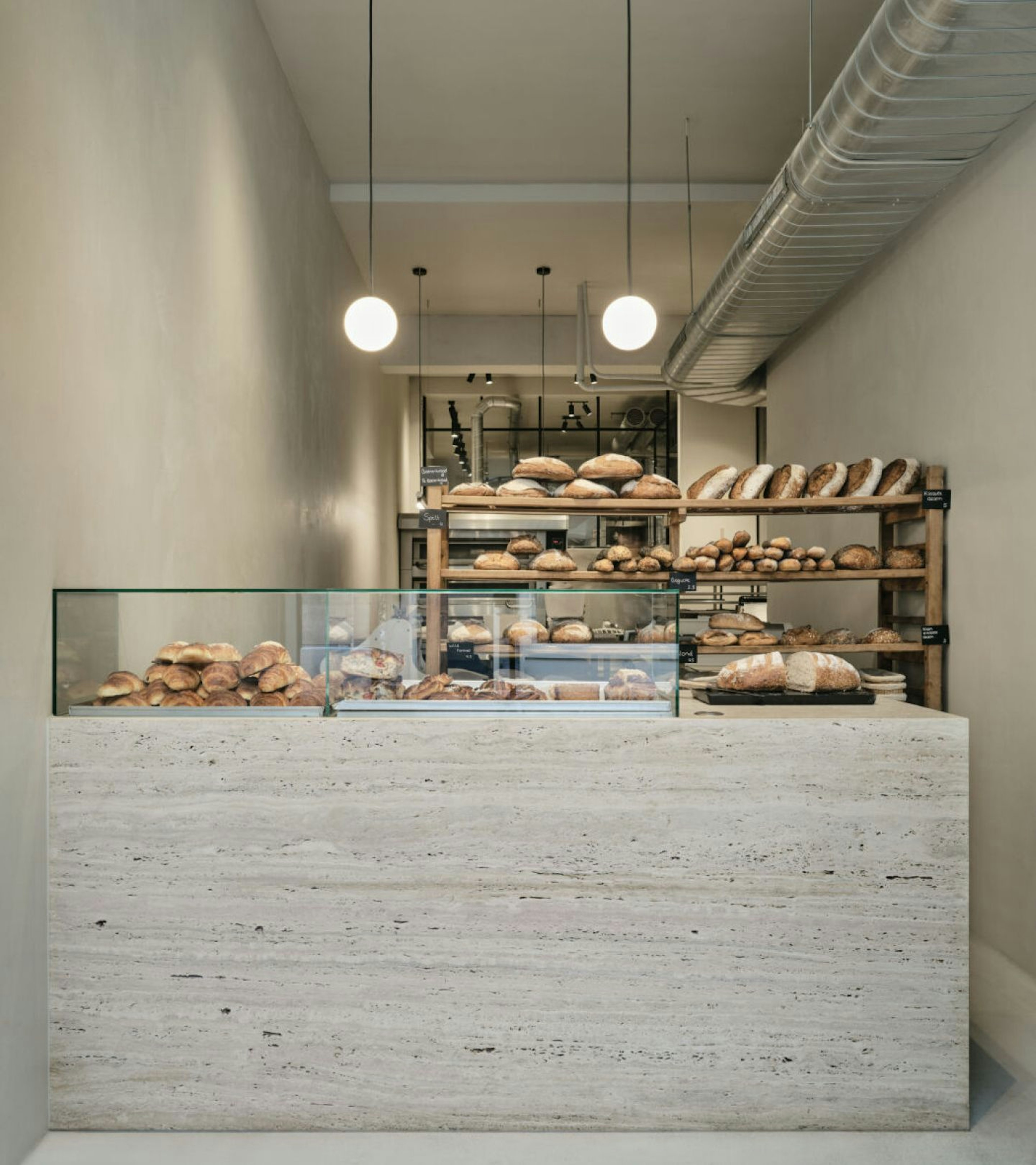 A view of the bakery with various breads on the counter