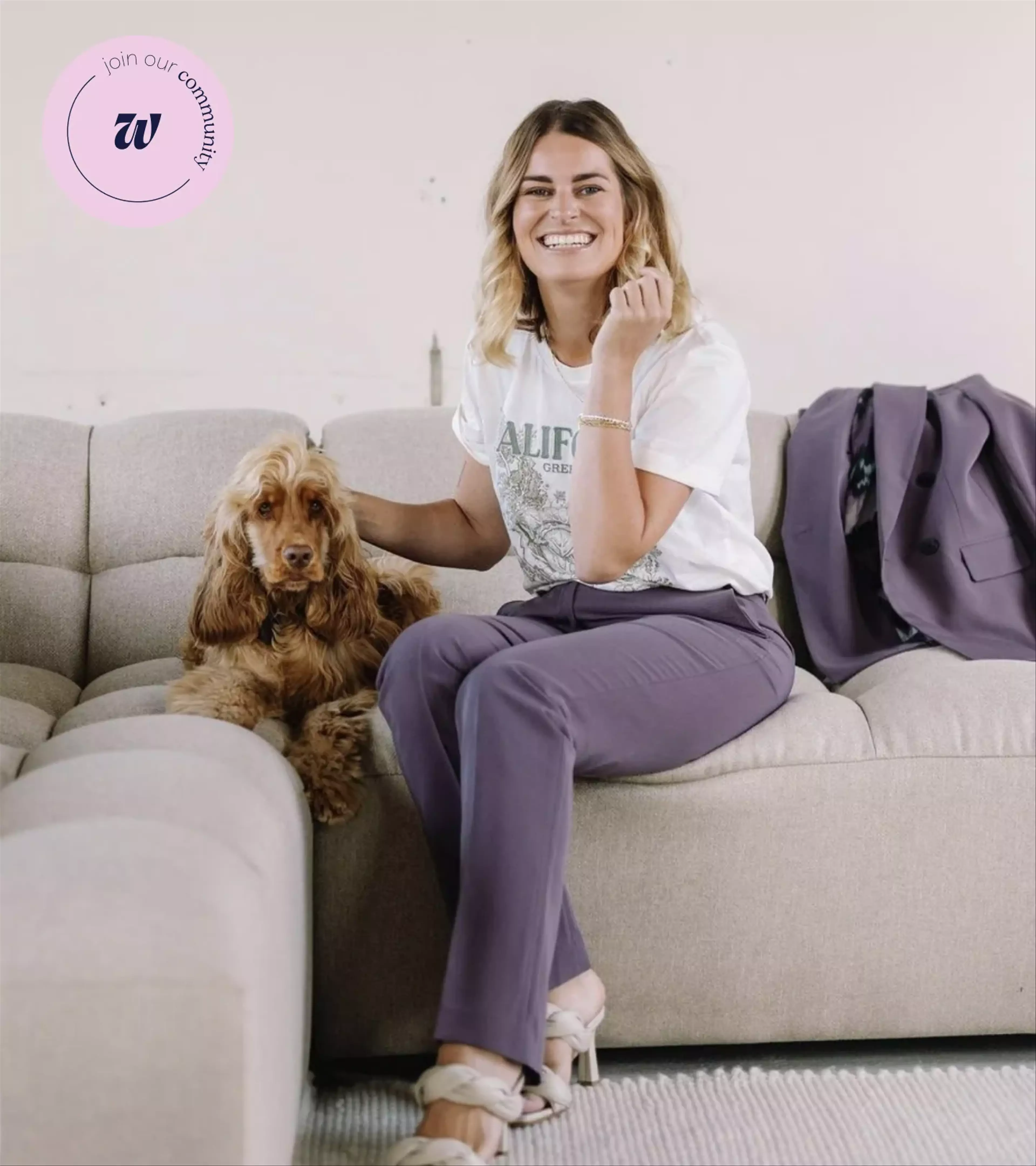 An image of a woman sitting on the couch with a dog