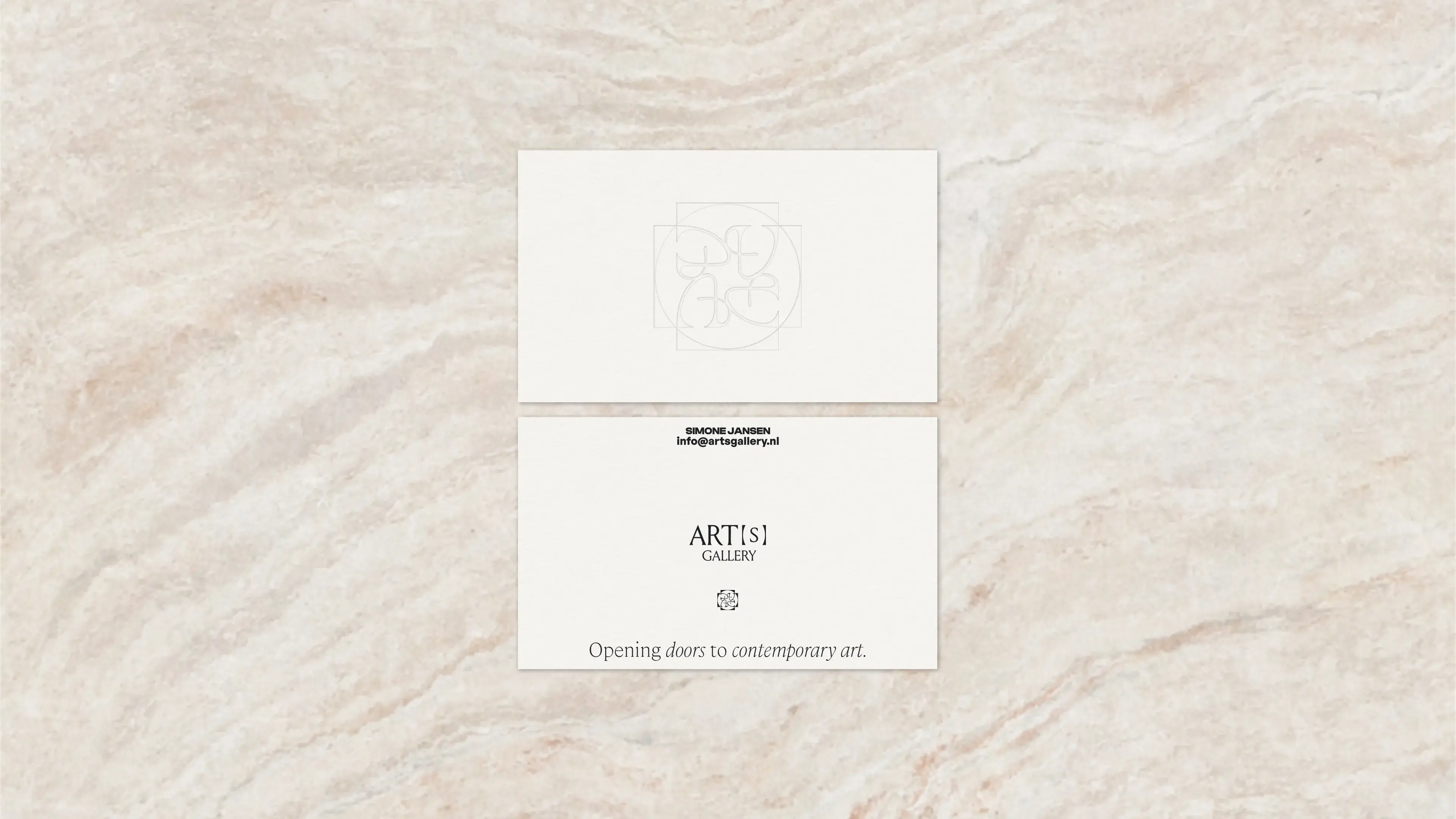 Business card with engraved logo and tagline