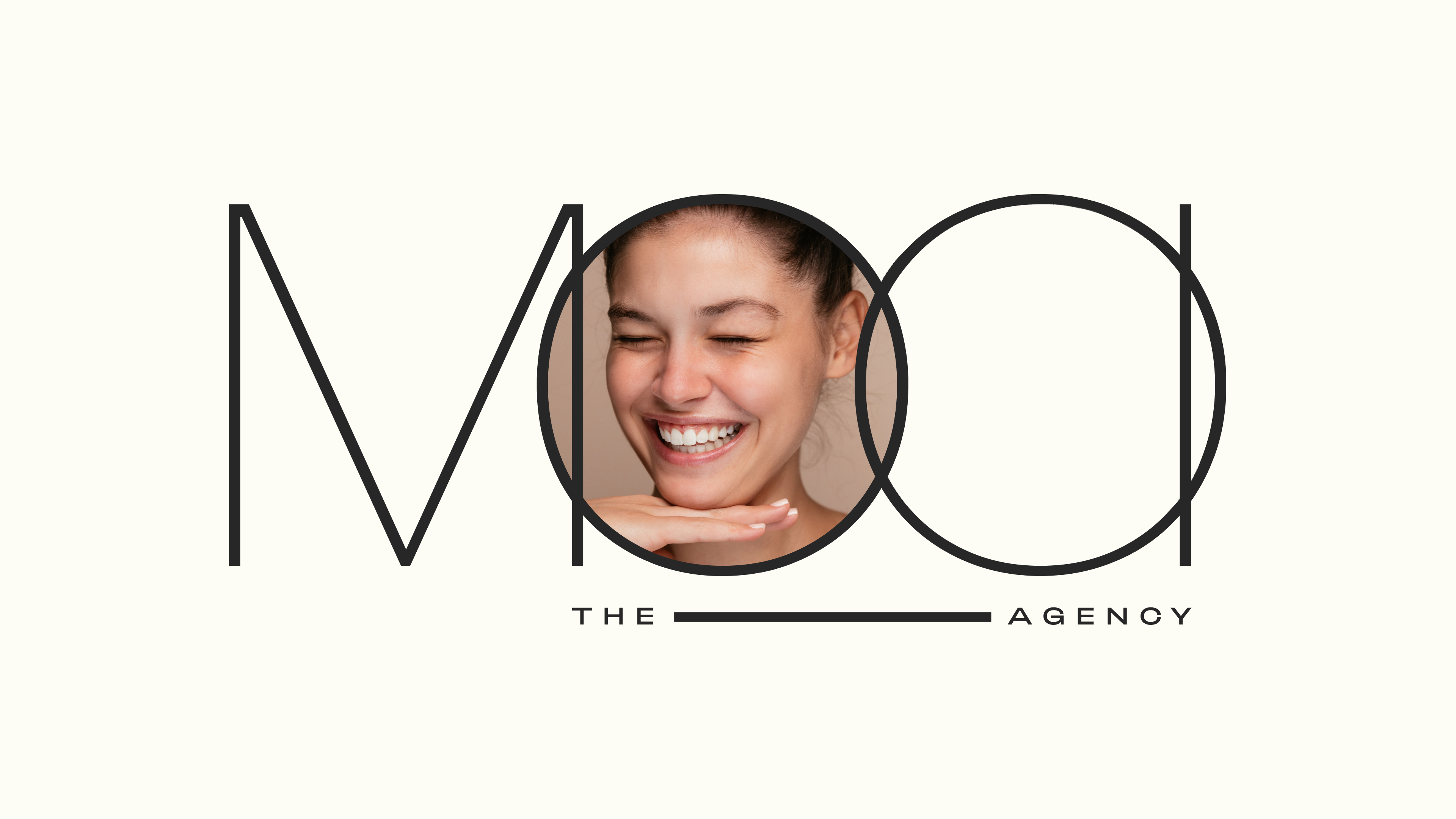 A gif of the MOOI the Agency logo with an image of a woman smiling in the first letter O of the logo