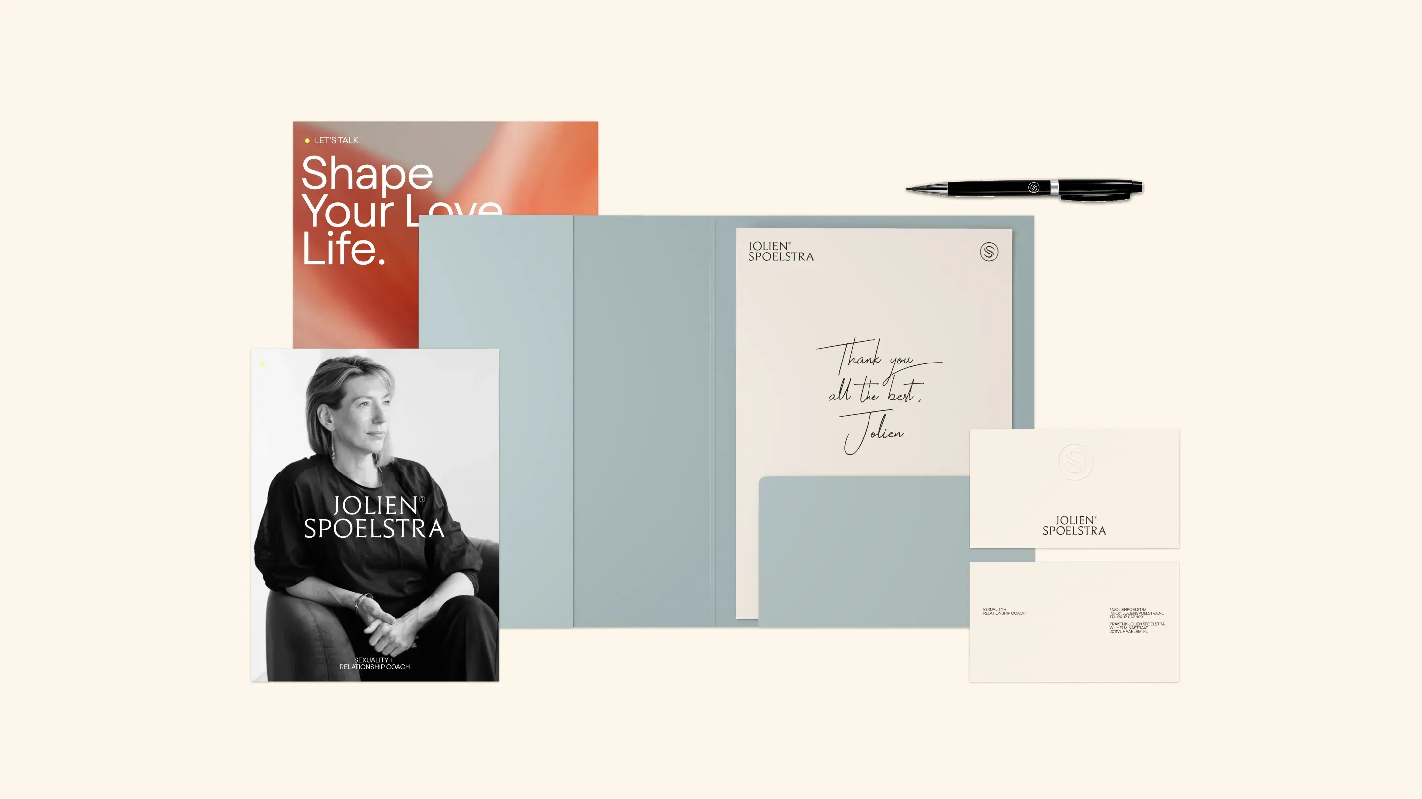 Stationery set with a folder, pen, business cards, a black-and-white portrait, and a booklet titled "Shape Your Love Life."